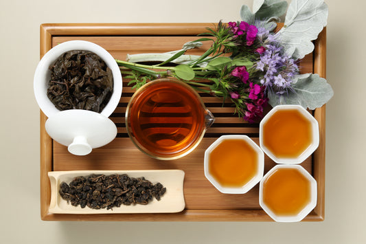Detailed photo of Dong Ding Medium Roasted Oolong on a Bamboo Tea Tray with Dry, Wet and Brewed Dong Ding Medium Roasted Oolong from Taiwan featured prominently.