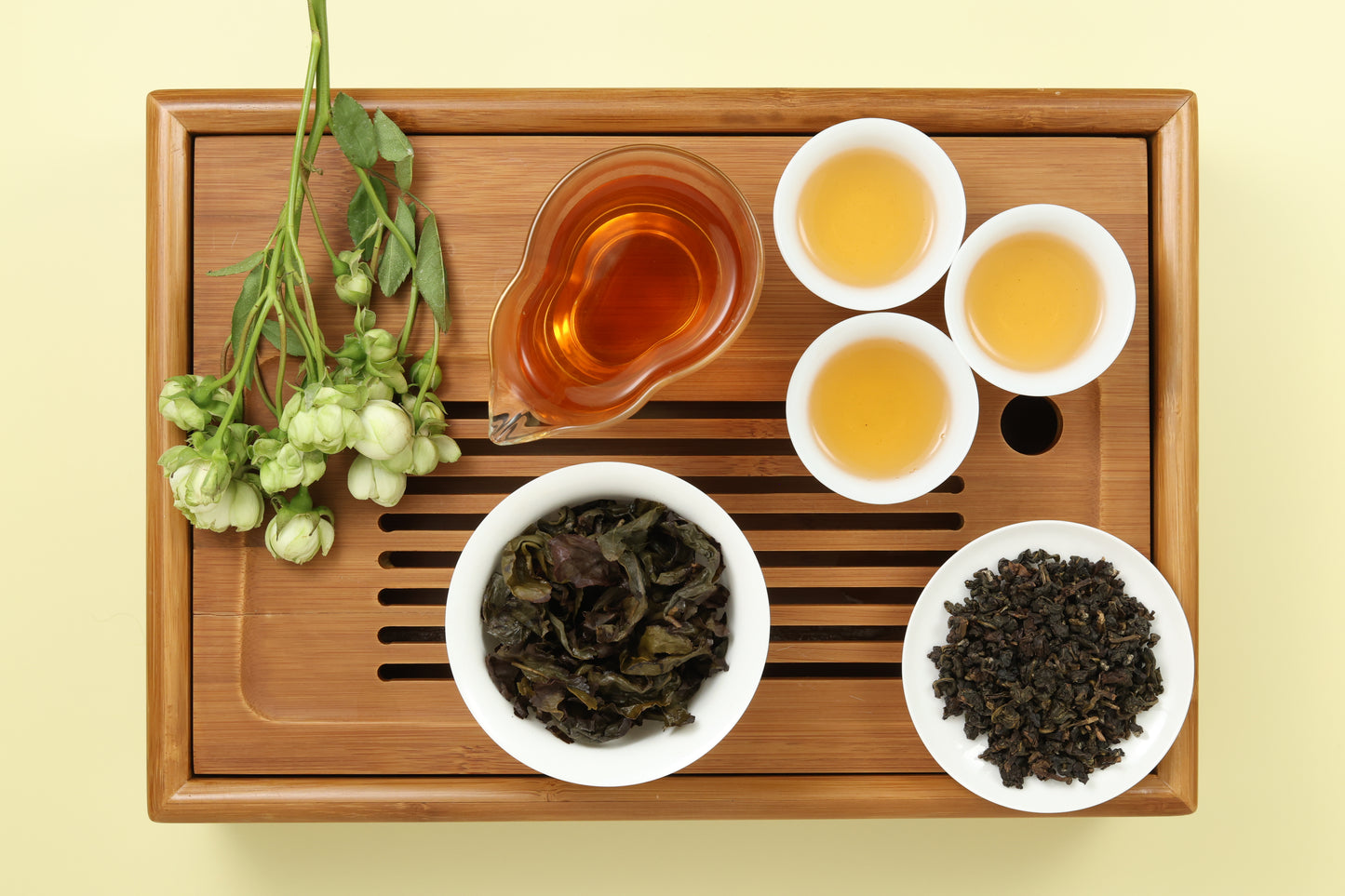 Detailed photo of Gui Fei Honey Oolong on a Bamboo Tea Tray with Dry, Wet and Brewed Gui Fei Honey Oolong from Taiwan featured prominently.
