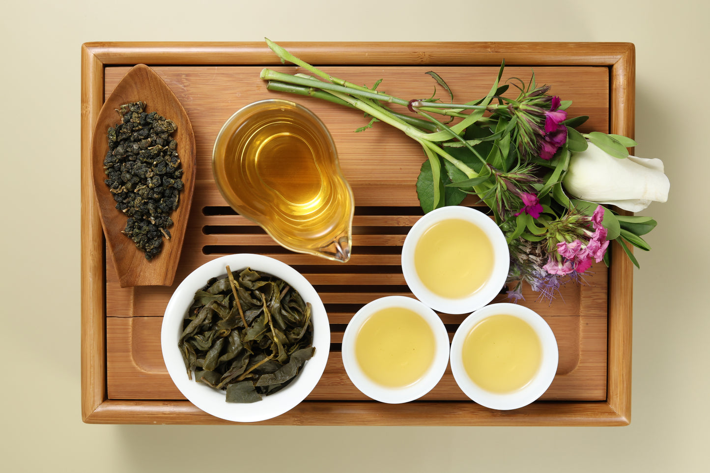 Detailed photo of Lishan High Mountain Oolong on a Bamboo Tea Tray with Dry, Wet and Brewed Lishan High Mountain Oolong from Taiwan featured prominently.